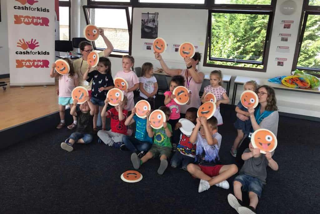 FCSS - staff and kids at Tay FM for 500 Faces