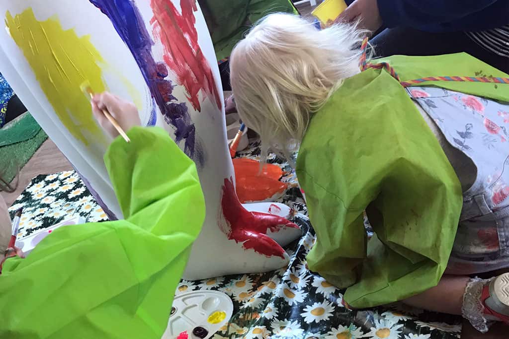 FCSS children paint Slinky the penguin
